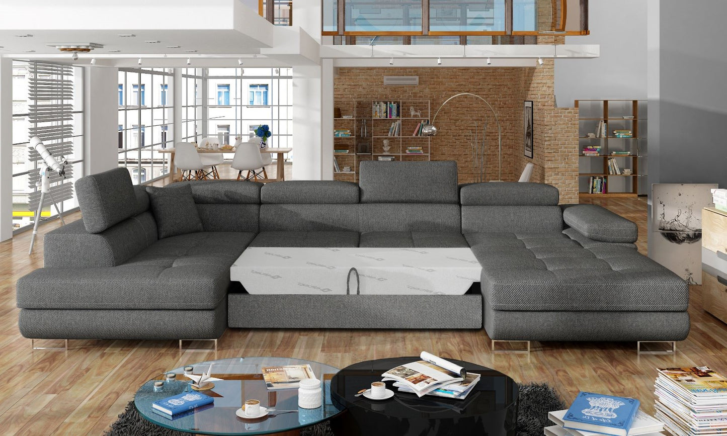 Narożnik Rodrigo Inari 96 ciemnoszary w układzie lewym z rozłożoną funkcją spania w jasnym salonie.