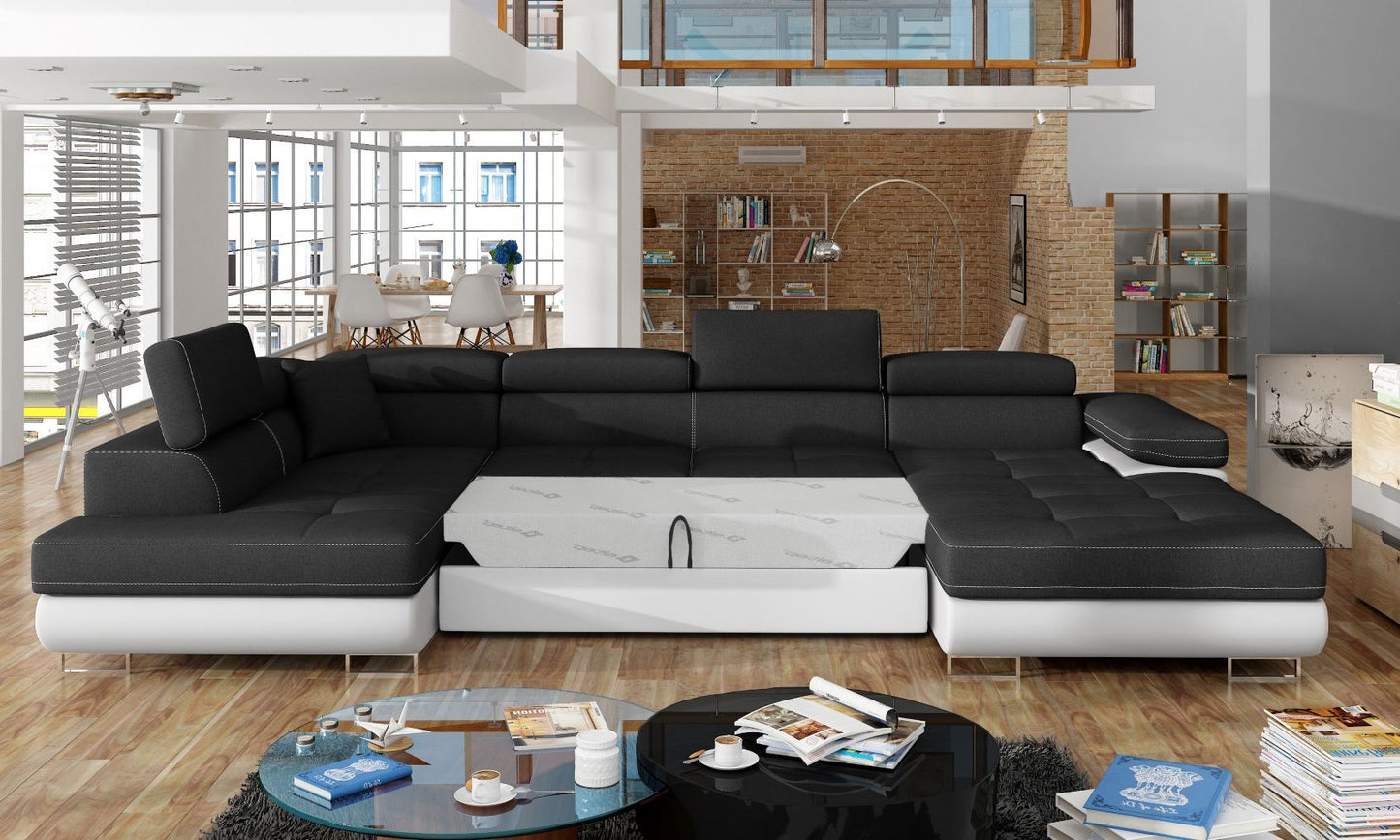 Narożnik Rodrigo Sawana 14 czarny / Soft 17 w układzie lewym z rozłożoną funkcją spania w jasnym salonie.