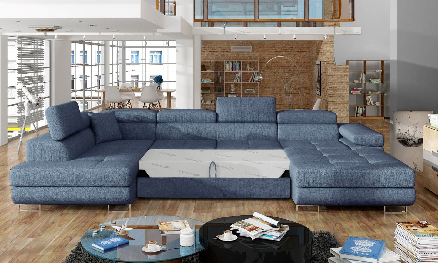 Narożnik Rodrigo Solid 77 granatowy w układzie lewym z rozłożoną funkcją spania w jasnym salonie.