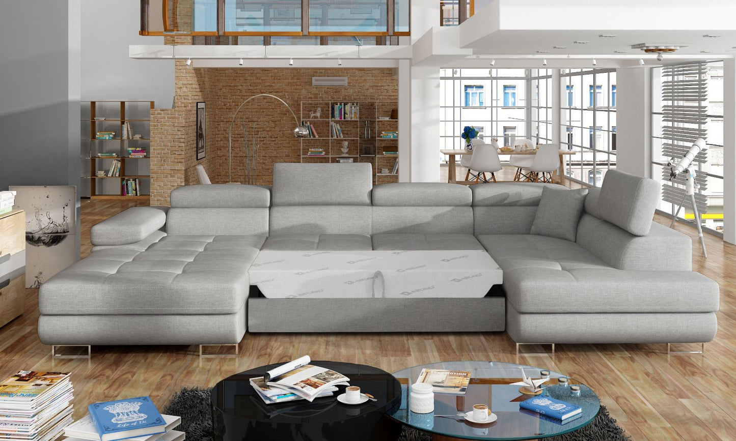 Narożnik Rodrigo Cover 83 szary w układzie prawym z rozłożoną funkcją spania w jasnym salonie.
