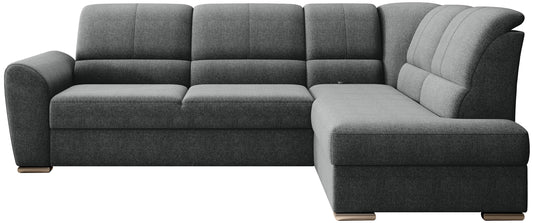 Ciemnoszary narożnik Siber prawy w tkaninie Vero 05 to nowoczesna sofa do salonu z funkcją spania i dużą powierzchnią wypoczynkową, idealna dla rodzin ceniących komfort i elegancki styl wnętrza.