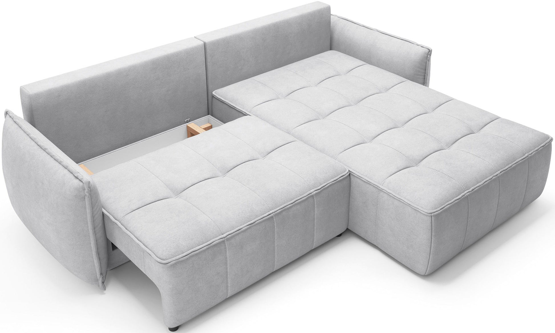 Sofa narożna Campo Relax 03 w prawym układzie rozłożona jako powierzchnia spania, z odsłoniętą konstrukcją we wnętrzu mebla i jasną zabudową z trójkątnymi przeszyciami.