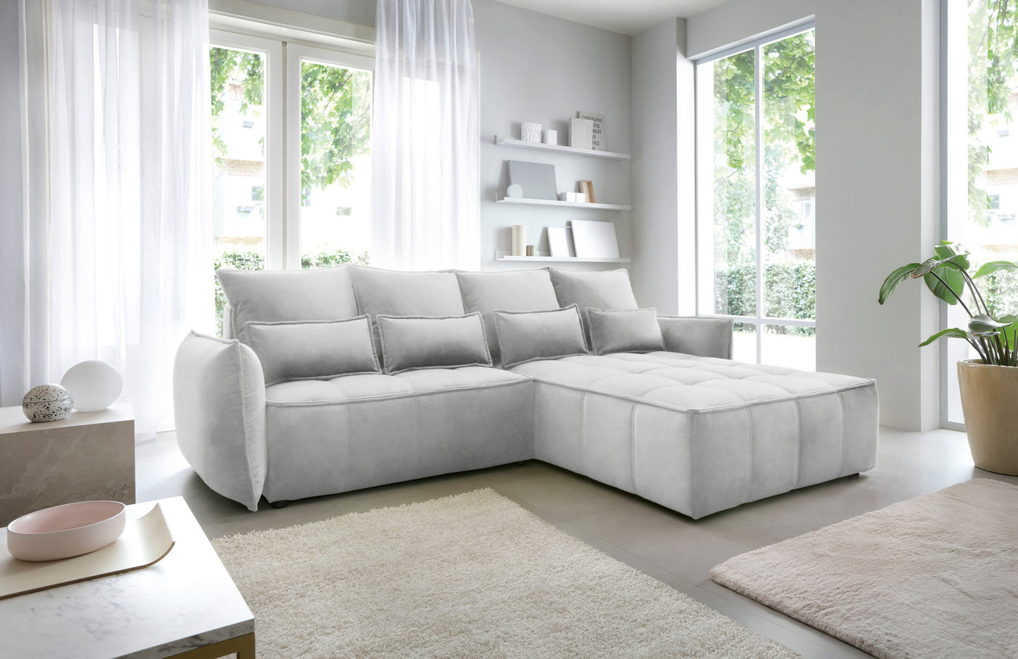 Widok z boku na narożnik Campo Relax 03 szary w układzie prawym, eksponujący obłe wykończenie bocznego podłokietnika i pikowany wzór tkaniny.