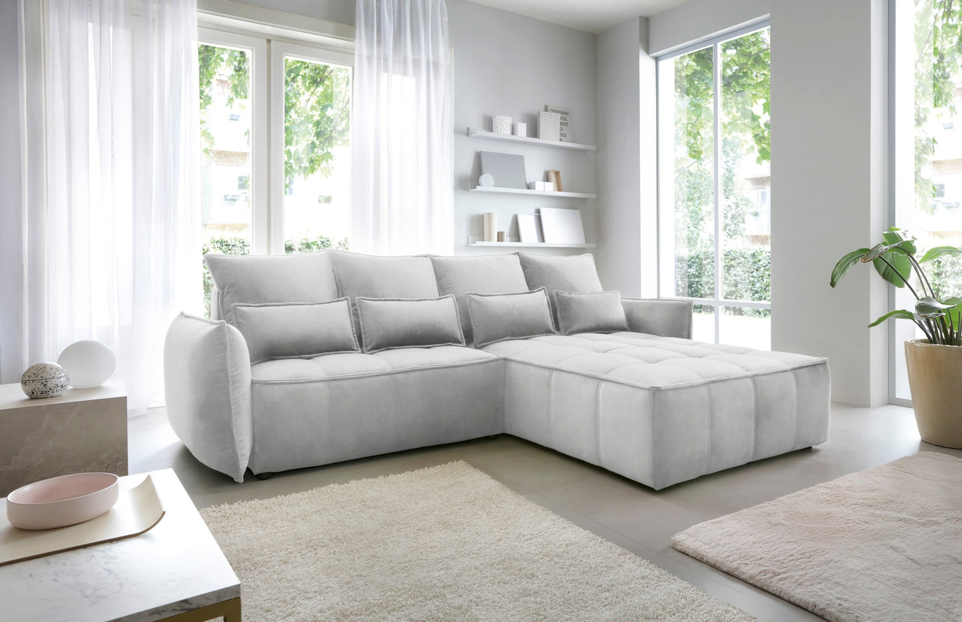 Widok z boku na narożnik Campo Relax 03 szary w układzie prawym, eksponujący obłe wykończenie bocznego podłokietnika i pikowany wzór tkaniny.