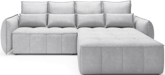 Narożnik Campo Relax 03 w kolorze szarym, ustawiony w układzie prawym, widoczny na białym tle w ujęciu frontalnym, z pikowanym siedziskiem i trójkątnymi poduszkami oparciowymi.