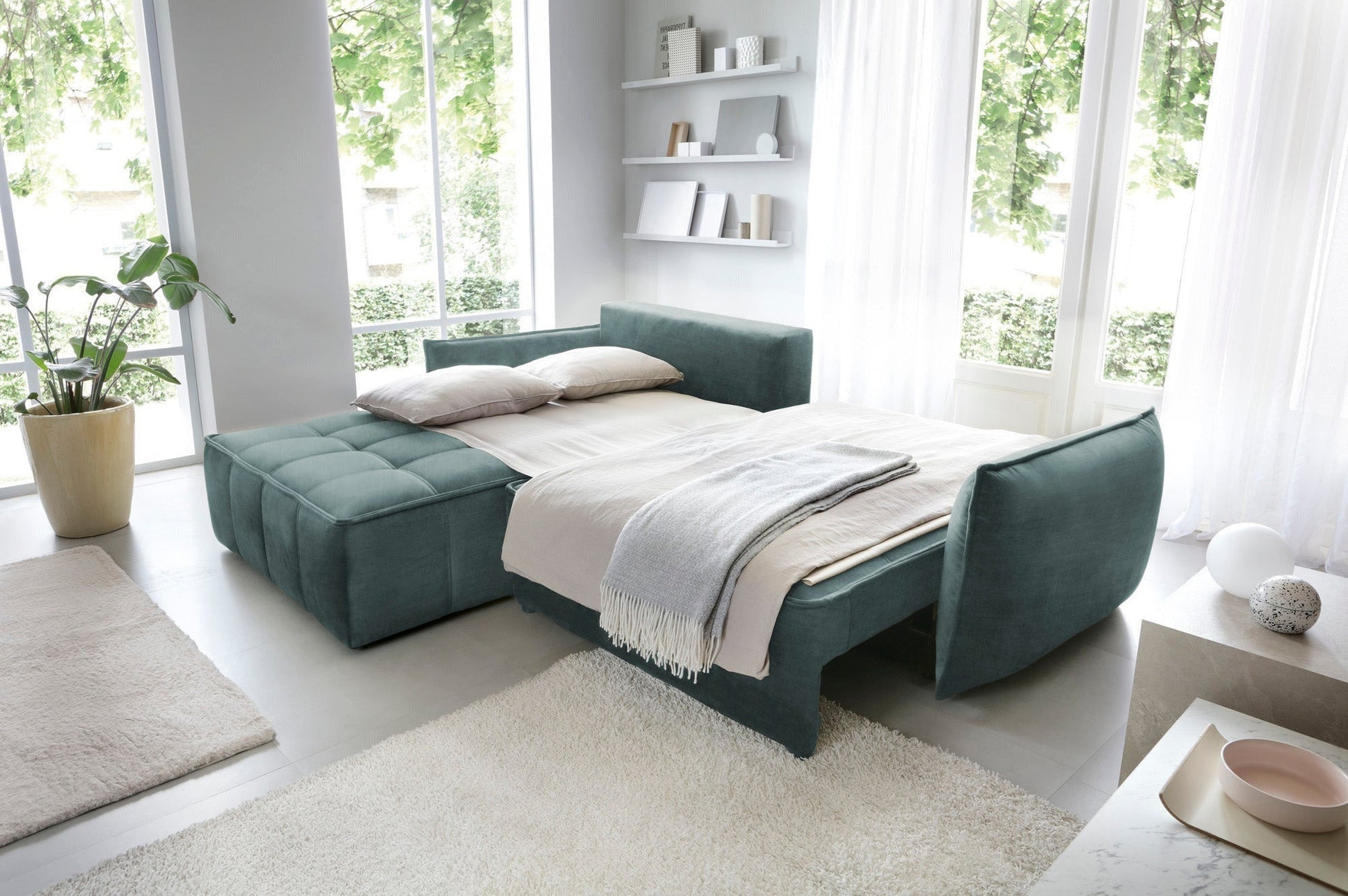 Kątowy widok narożnika Campo Manhattan 38 zielony, eksponujący miękkie, prostokątne poduszki oparciowe oraz stylowy pikowany wzór siedziska.