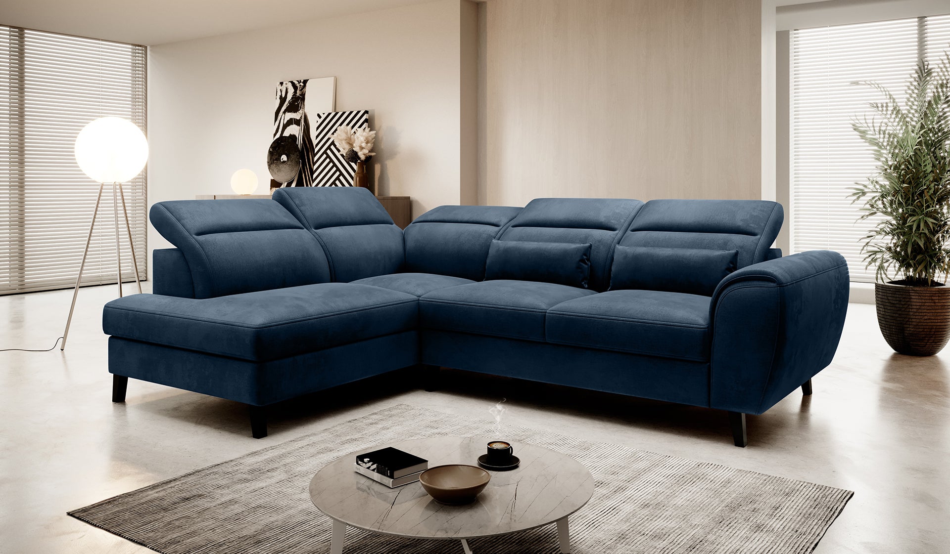 Narożnik Noble Nube 40 w głębokim granatowym kolorze prezentujący komfortowe siedziska, dekoracyjne poduszki oraz nowoczesne wykończenie tapicerki. Designerski narożnik wypoczynkowy do eleganckiego salonu i apartamentów premium.