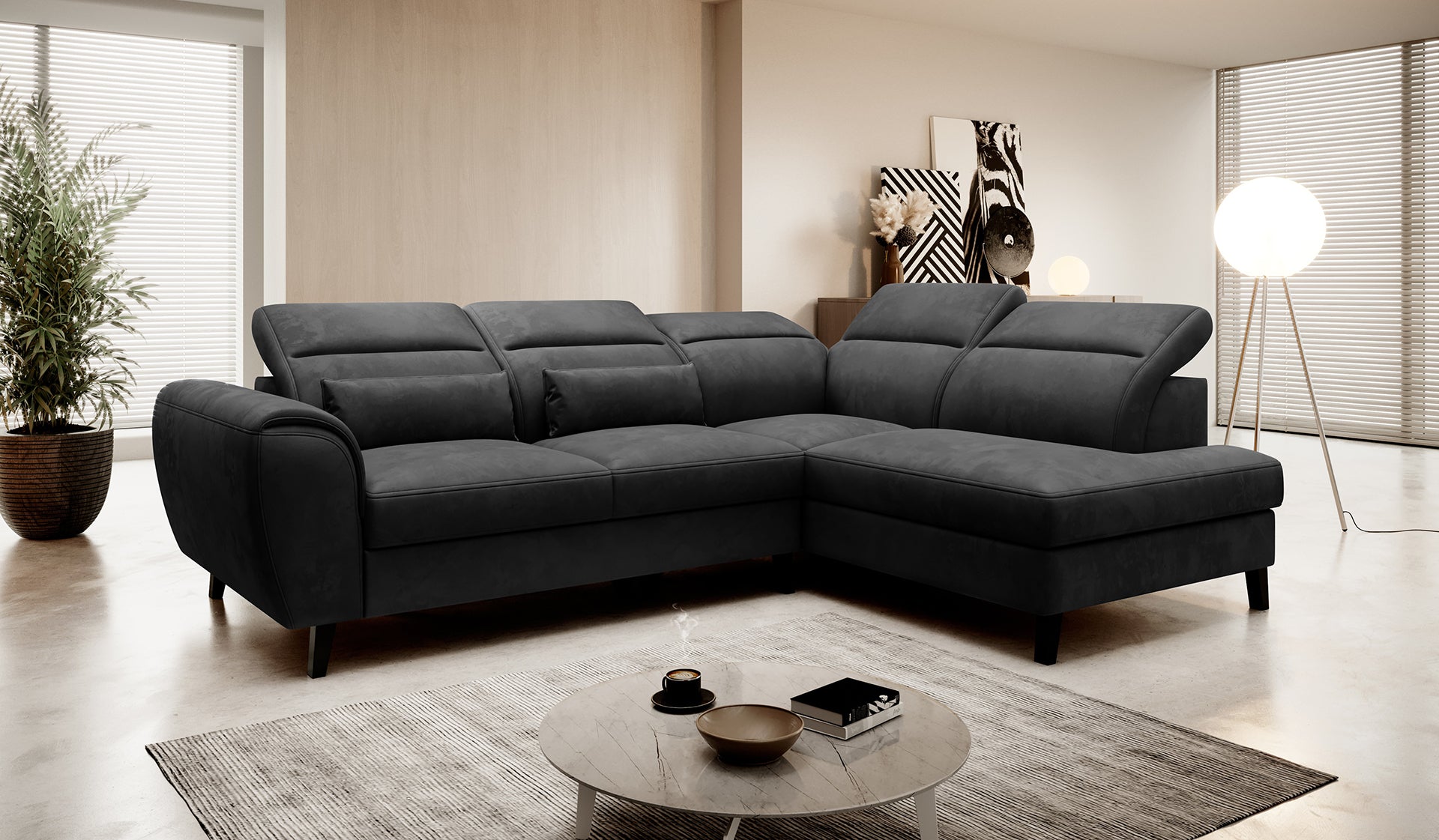 Narożnik Noble Nube 06 w grafitowym kolorze prezentujący komfortowe siedziska, dekoracyjne poduszki oraz eleganckie wykończenie tapicerki. Designerski narożnik wypoczynkowy do nowoczesnego salonu i apartamentów premium.