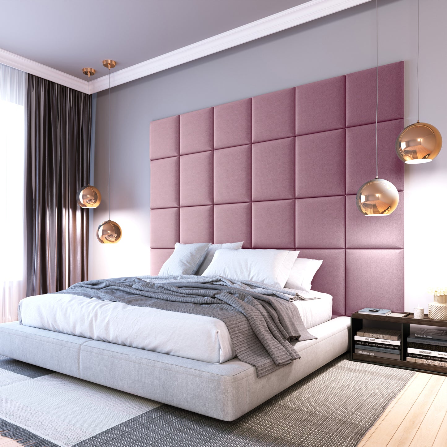 Nowoczesna sypialnia z dużym zagłówkiem ułożonym z paneli Quadratta IV Monolith 63 w pastelowym różowym kolorze za wezgłowiem niskiego łóżka, udekorowana wiszącymi lampami i szarą pościelą.