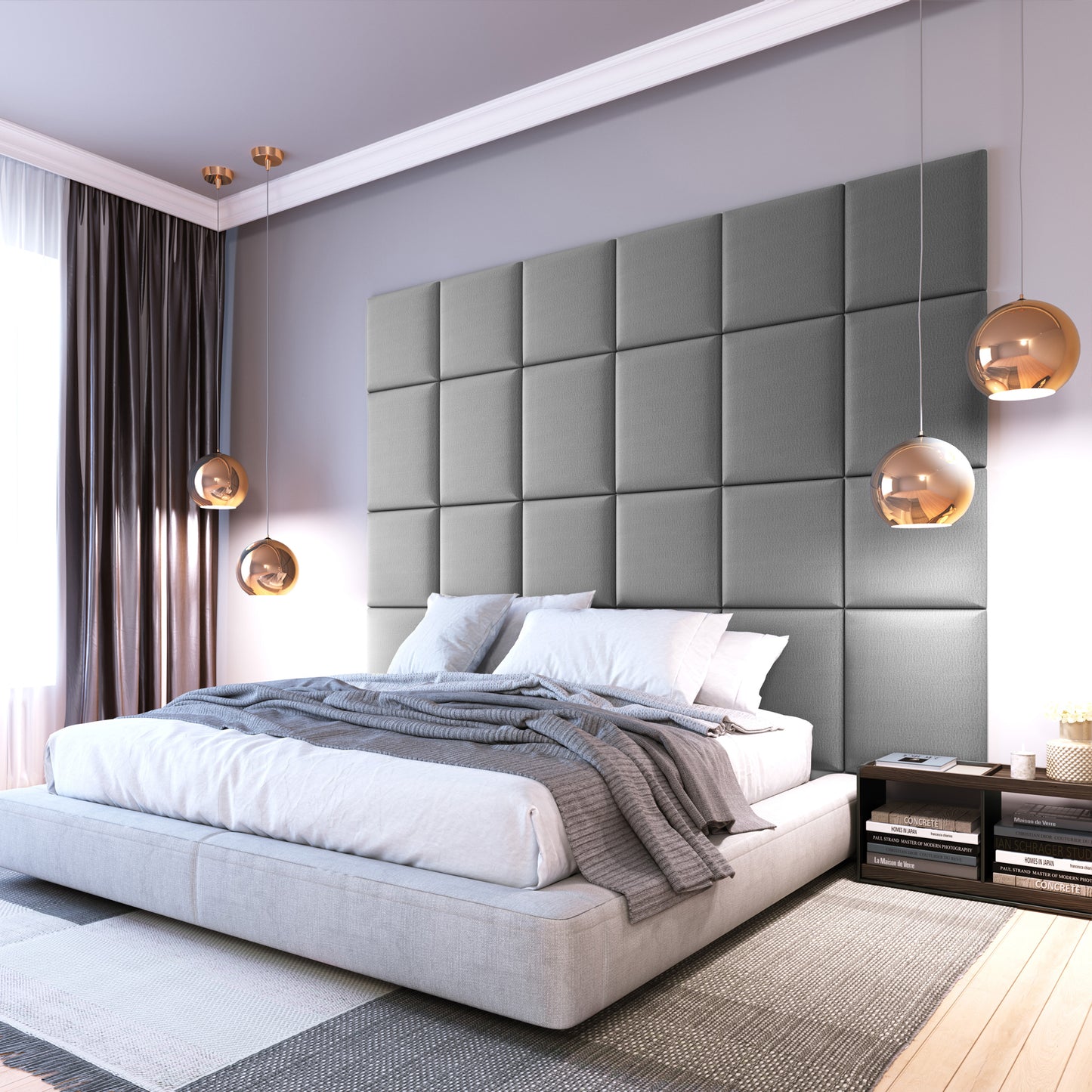 Nowoczesna sypialnia z wezgłowiem wyłożonym panelami Quadratta IV Monolith 84 w jasnoszarym kolorze za niskim łóżkiem, udekorowana wiszącymi kulistymi lampami i szarą pościelą.