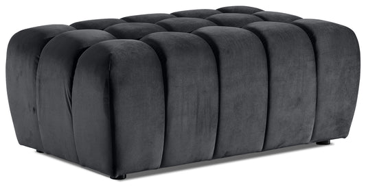 Pufa Lazaro Monolith 97 ciemnoszara – widok perspektywiczny: prostokątna, pikowana pufa obita aksamitnym welwetem w intensywnym ciemnoszarym odcieniu, z regularnymi, zaokrąglonymi przetłoczeniami biegnącymi wzdłuż całej powierzchni.