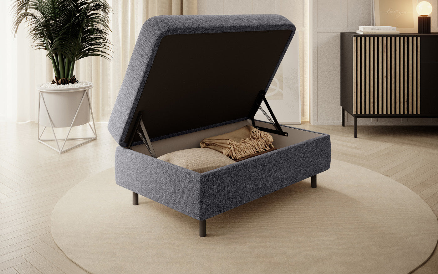 Pufa z pojemnikiem, prostokątna, ciemnoszara z przeszyciami.