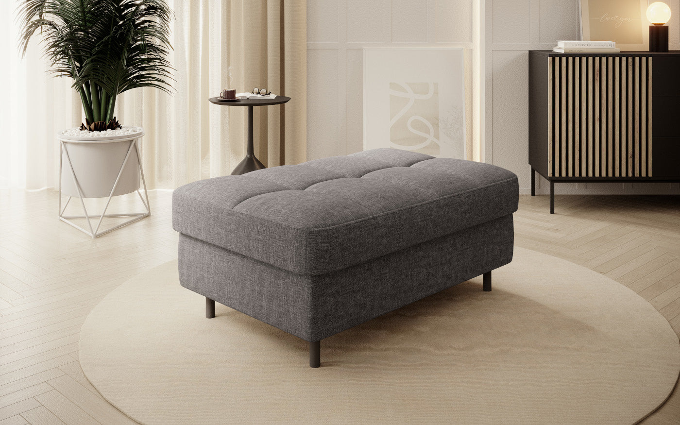 Pufa do siedzenia, prostokątna, szara z przeszyciami.