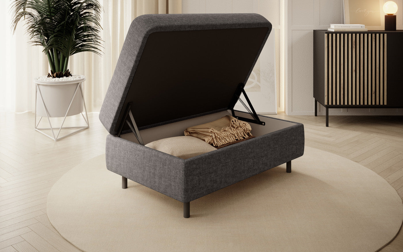 Pufa z pojemnikiem, prostokątna, szara z przeszyciami.