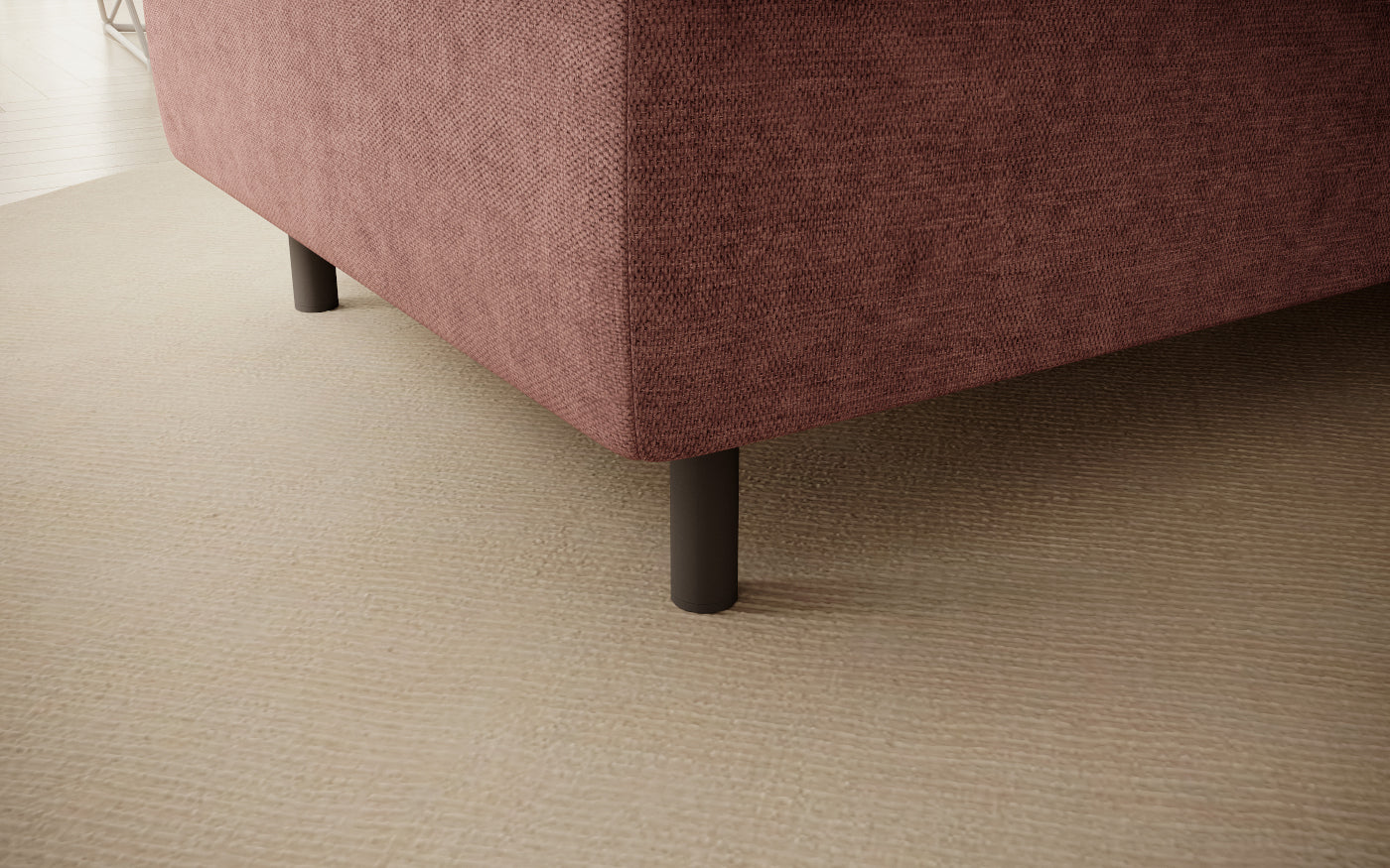 Pufa do siedzenia, prostokątna, jasnoróżowa z przeszyciami, detal nóżek.