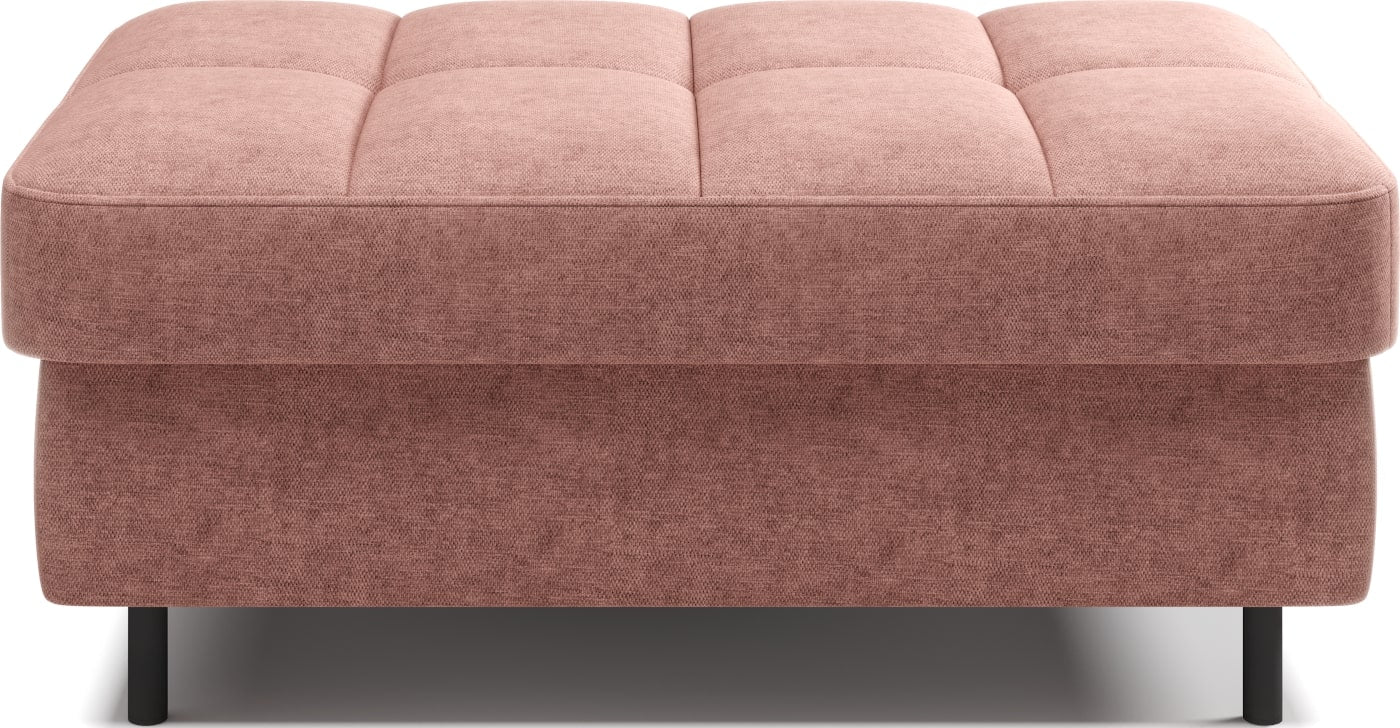 Pufa na białym tle, prostokątna, jasnoróżowa z przeszyciami.