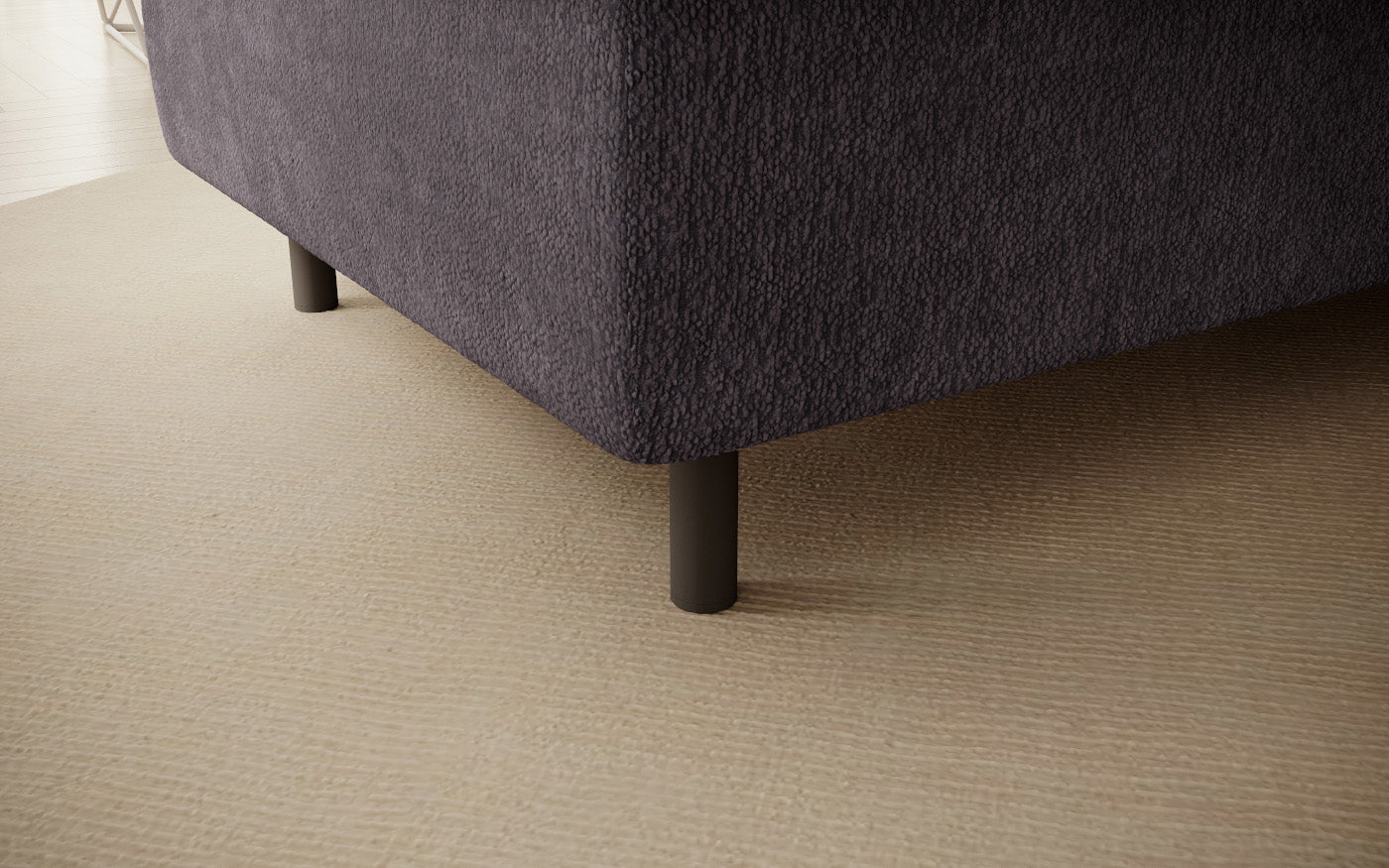 Pufa do siedzenia, prostokątna, szara z przeszyciami, detal nóżek.