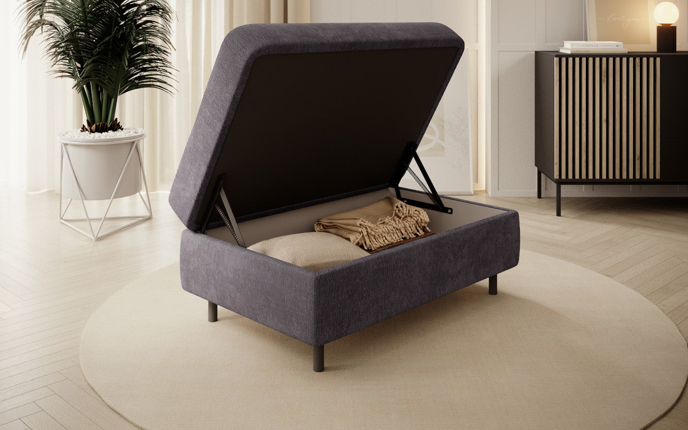 Pufa z pojemnikiem, prostokątna, szara z przeszyciami.