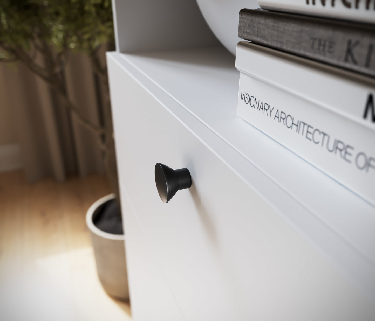 Zbliżenie na czarny uchwyt szuflady regału Dullum, widoczne detale wykończenia i półka z książkami.