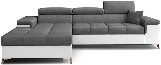 Narożnik Ricardo w układzie lewym, tapicerowany tkaniną Sawana 05 ciemnoszary z wykończeniem Soft 17 biały, wyposażony w regulowane zagłówki, szerokie podłokietniki i poduszkę dekoracyjną, prezentowany na białym tle.