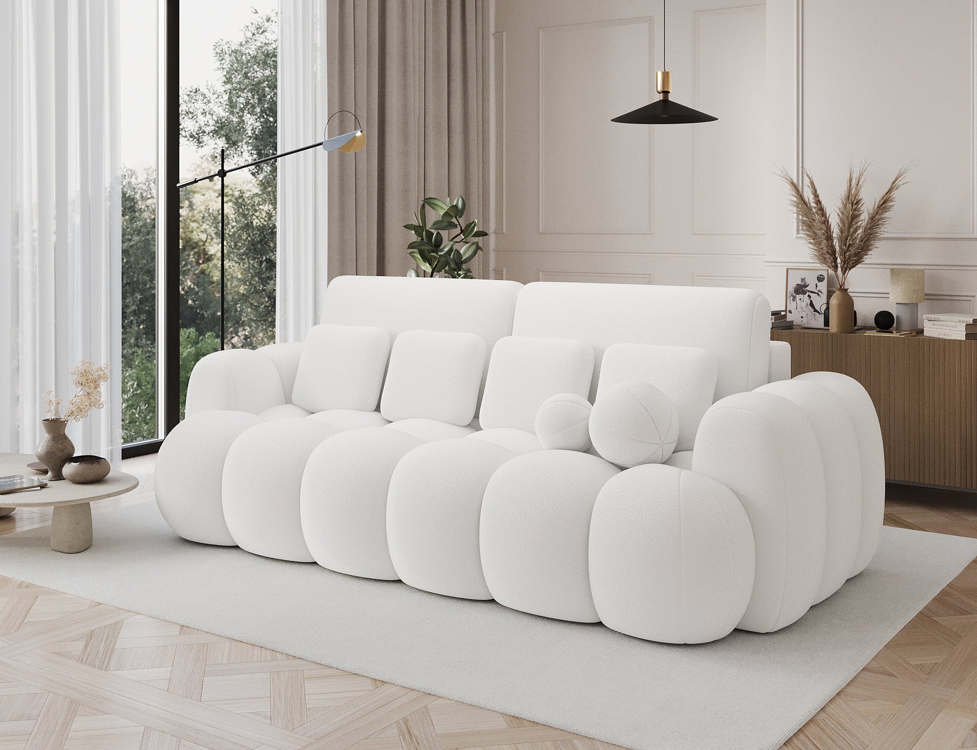 Big Sofa Cotonn w tkaninie Paolli 01 biały – elegancka sofa o organicznej formie w jasnej aranżacji wnętrza z naturalnym światłem.