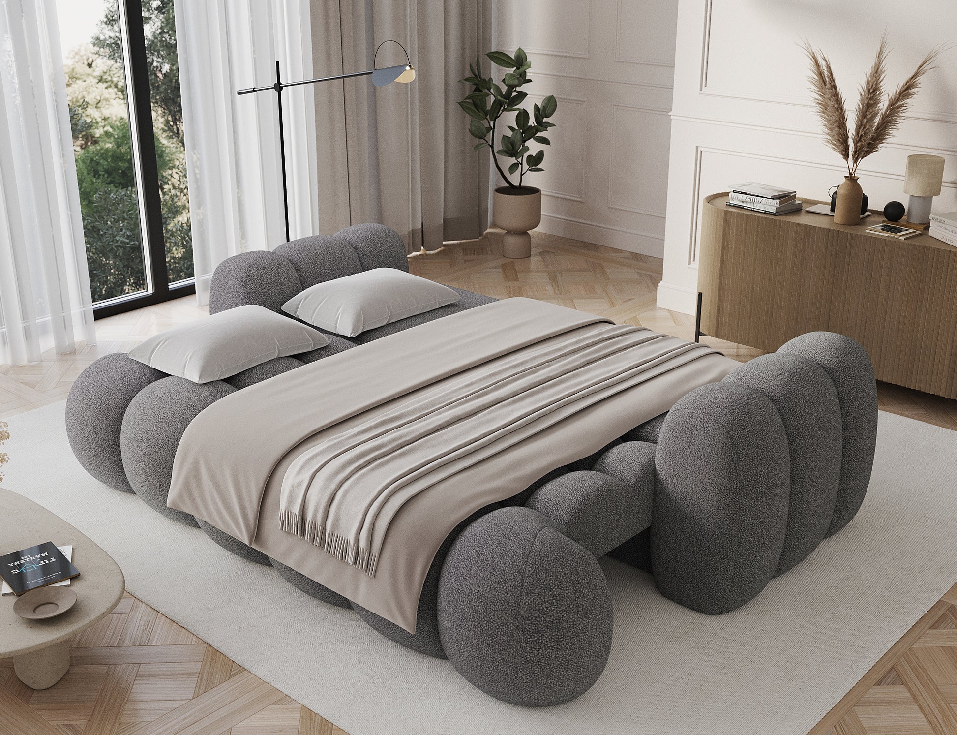 Rozłożona Big Sofa Cotonn z funkcją spania, tapicerowana tkaniną Paolli 04 szary, ustawiona w eleganckim salonie.