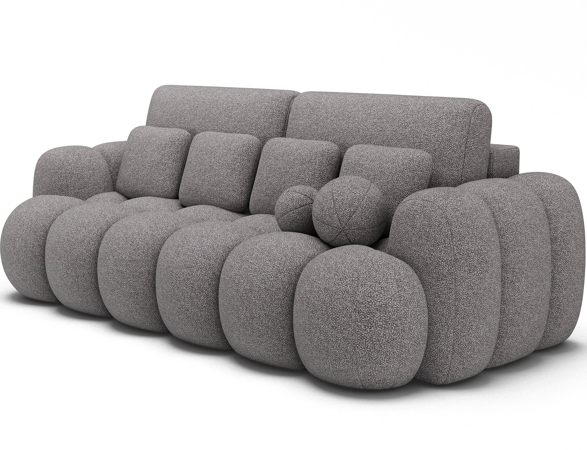Big Sofa Cotonn w tkaninie Paolli 04 szary, widok z ukosa na miękką bryłę z poduszkami o nieregularnych kształtach i masywnych bokach.