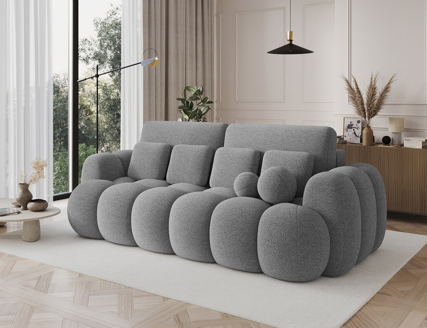 Big sofa Cotonn Royal 04 szary w nowoczesnym wnętrzu, widok z boku, elegancki design i poduszki w komplecie.