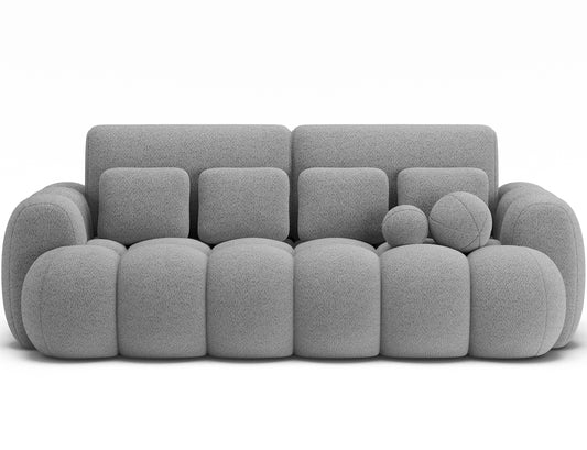 Big sofa Cotonn w tkaninie Royal 04 szary, z dodatkowymi poduszkami i zaokrąglonymi kształtami, widok na wprost.