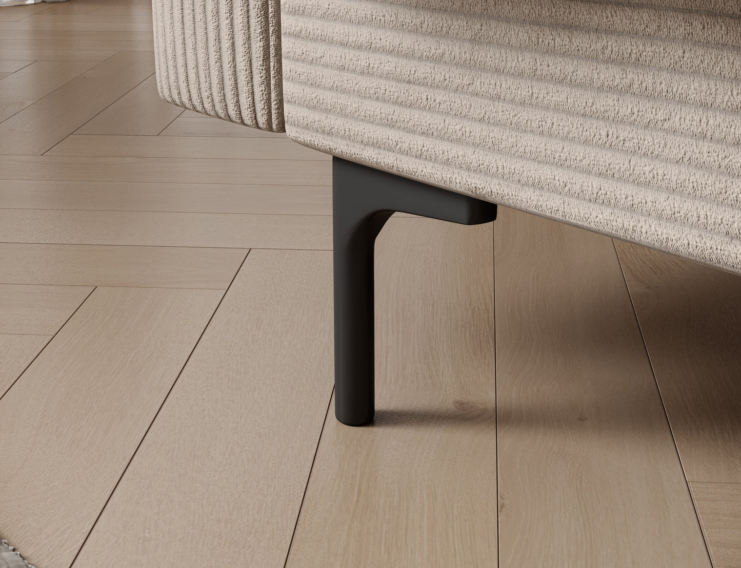 Zbliżenie na plastikowe, czarne nogi sofy Roneyy – solidna podstawa i stabilna konstrukcja