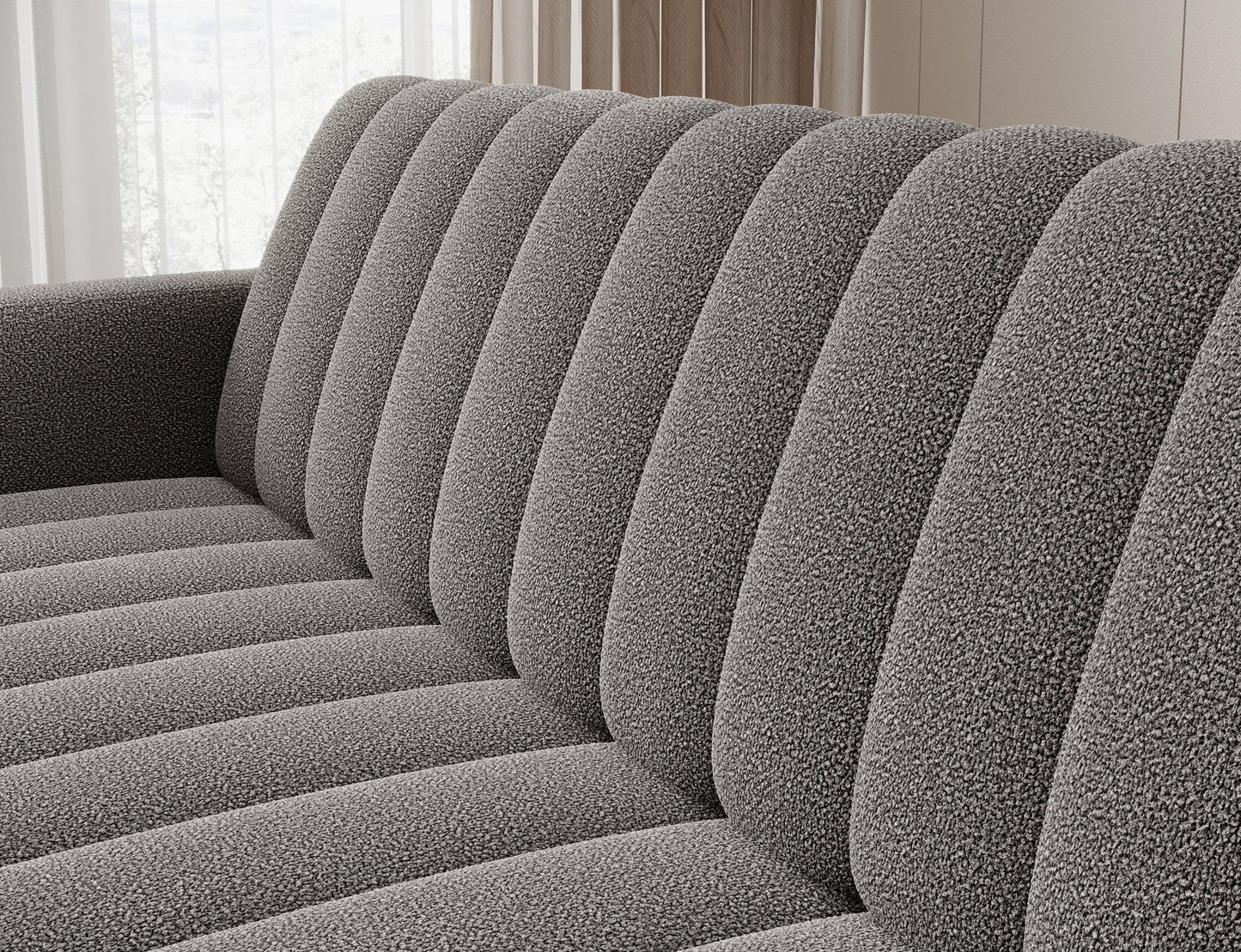 Pikowane oparcie sofy Roneyy Xillar 04 szary – miękka, strukturalna tkanina i nowoczesne przeszycia.