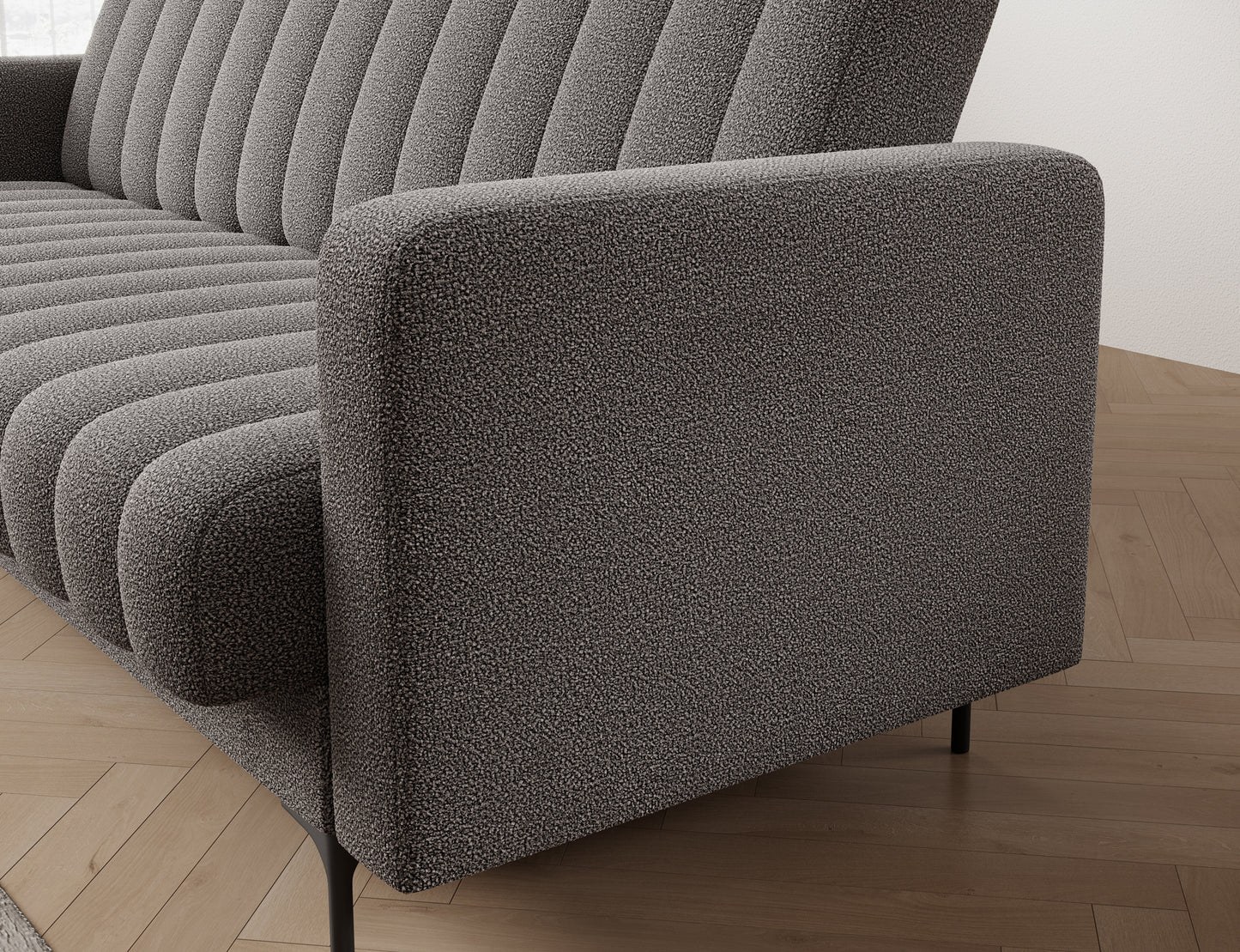 Bok sofy Roneyy Xillar 04 szary z detalem przeszycia i gładką linią podłokietnika – minimalistyczna elegancja.