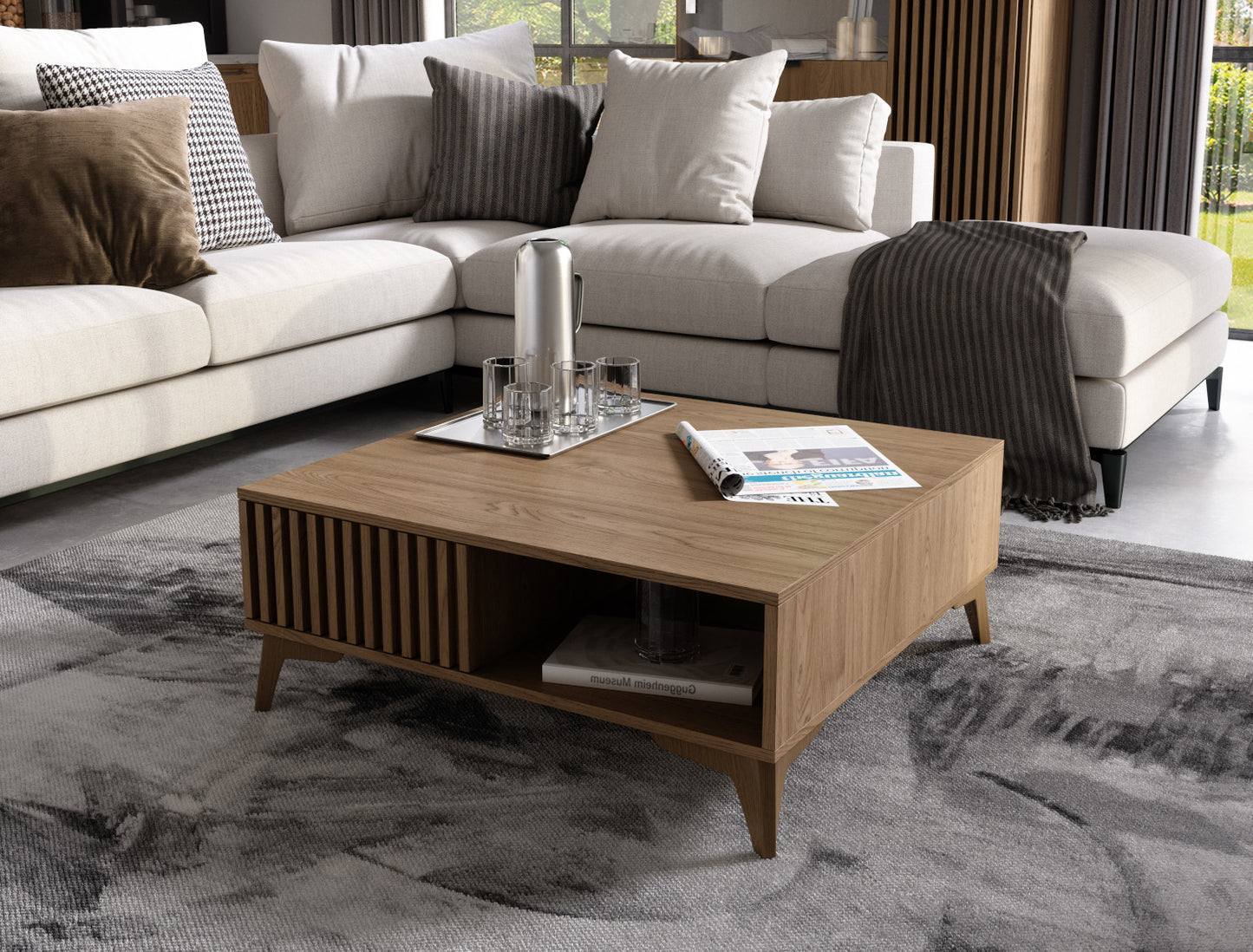 Stolik kawowy Entsian w salonie – widok frontowy z sofą.