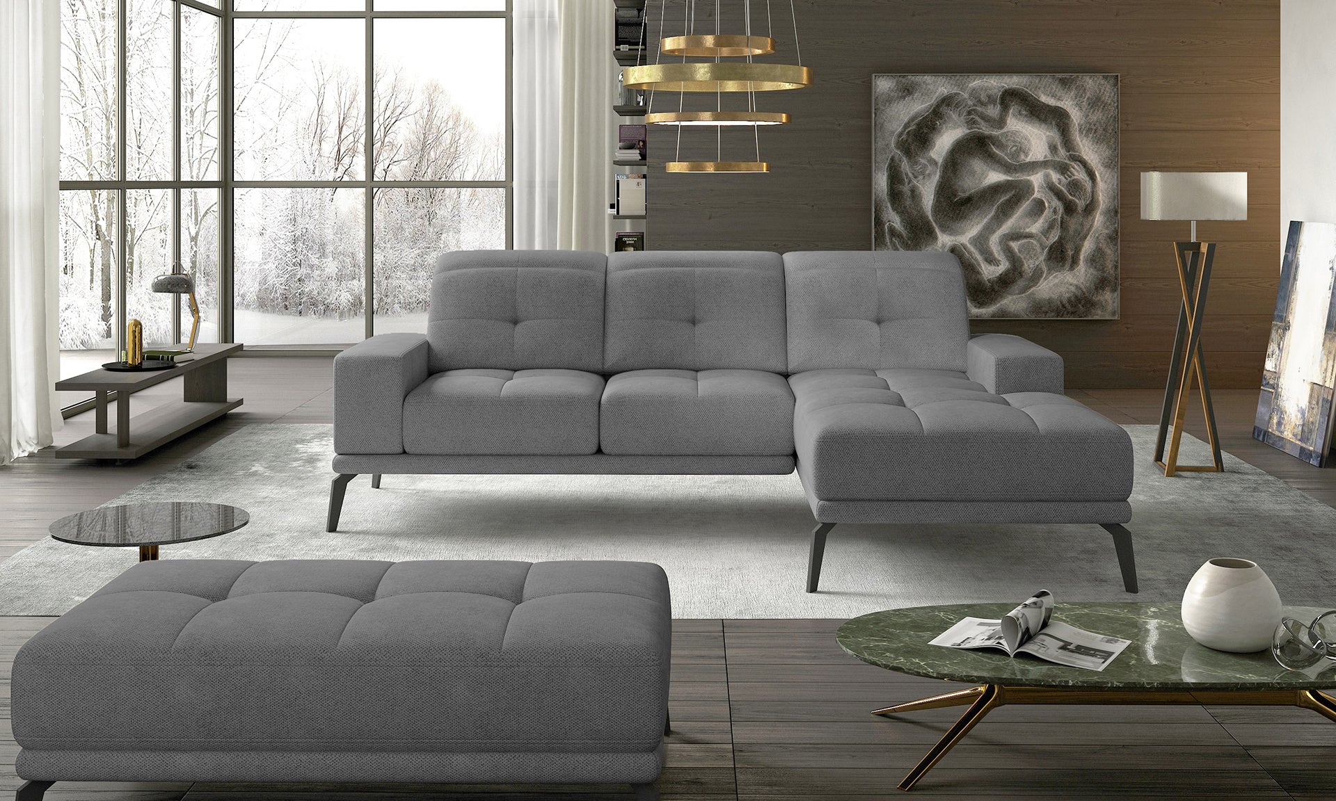 Designerski narożnik w szarej tkaninie Soro 93 z wygodnymi poduszkami oparciowymi oraz nowoczesną linią. Duży narożnik wypoczynkowy do salonu tworzący funkcjonalną strefę codziennego odpoczynku i relaksu.