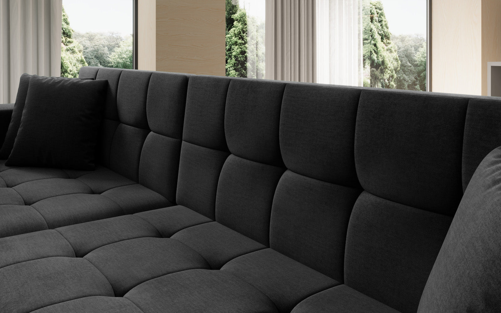 Duży narożnik Solange lewy w tkaninie Monolith 97 w kolorze ciemnoszarym to komfortowa sofa wypoczynkowa, która łączy funkcjonalność z eleganckim i ponadczasowym stylem wnętrza.