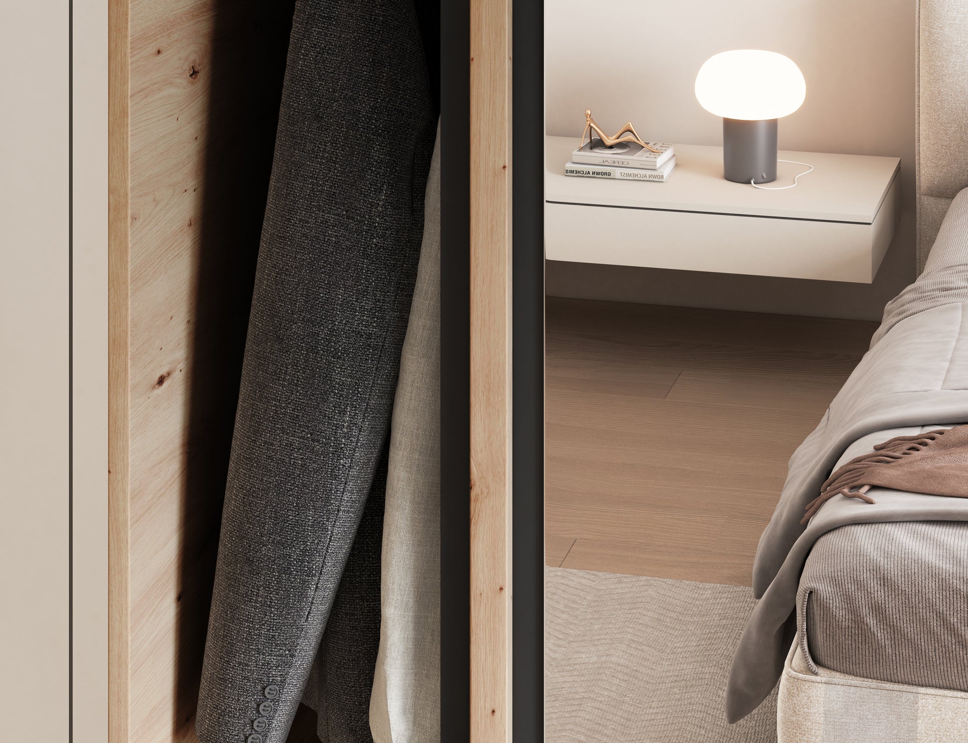 Zbliżenie na drzwi przesuwne szafy Emerio II z lustrem. Widoczne ubrania wewnątrz oraz odbicie wnętrza sypialni w nowoczesnym stylu.