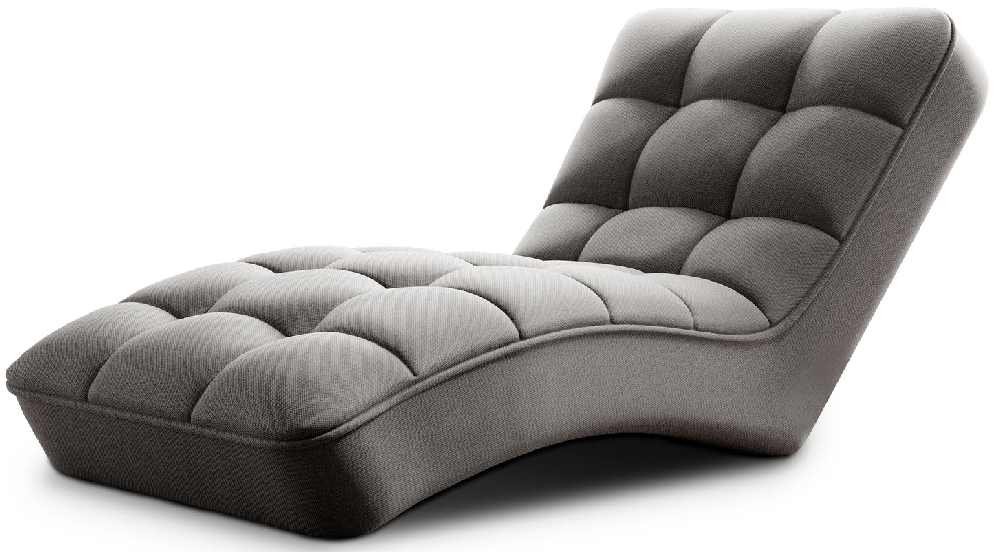 Szezlong Loren w kolorze Vero 04 jasnoszary z pikowanym siedziskiem i falistą linią konstrukcji, prezentowany na białym tle.