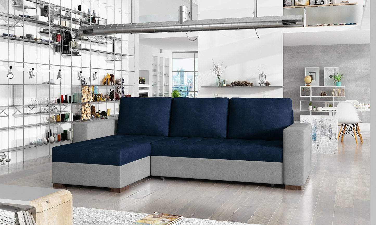 Uniwersalny narożnik z funkcją spania Newark wykonany w tkaninie Kronos 9 i Paros 5 prezentujący minimalistyczną formę oraz pikowane siedzisko. Designerski mebel wypoczynkowy do nowoczesnych i industrialnych wnętrz.