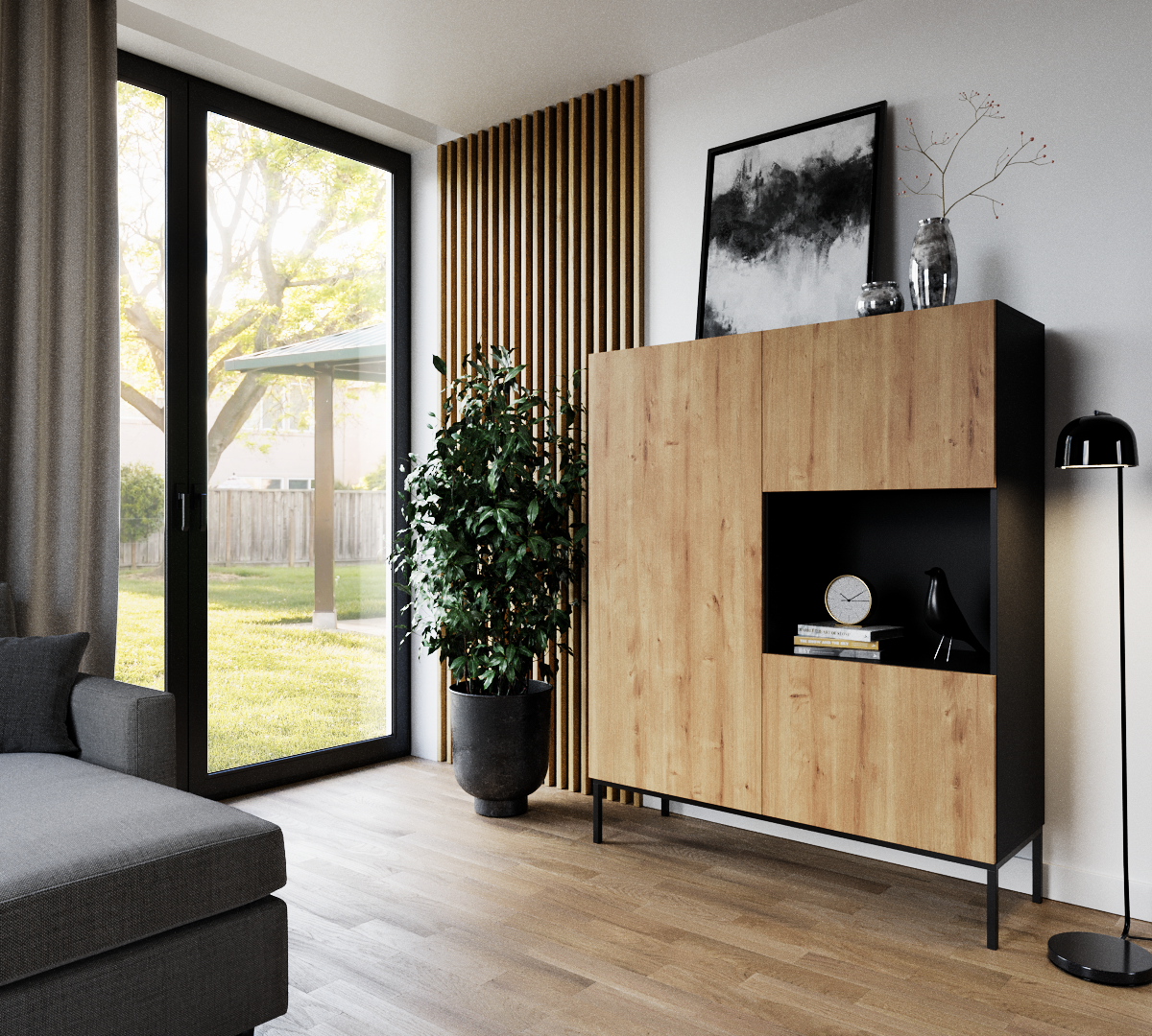 Witryna Lanzzi czarny mat/Dąb artisan ustawiona w nowoczesnym salonie przy dużych, przeszklonych drzwiach, obok doniczkowej rośliny i lampy podłogowej.