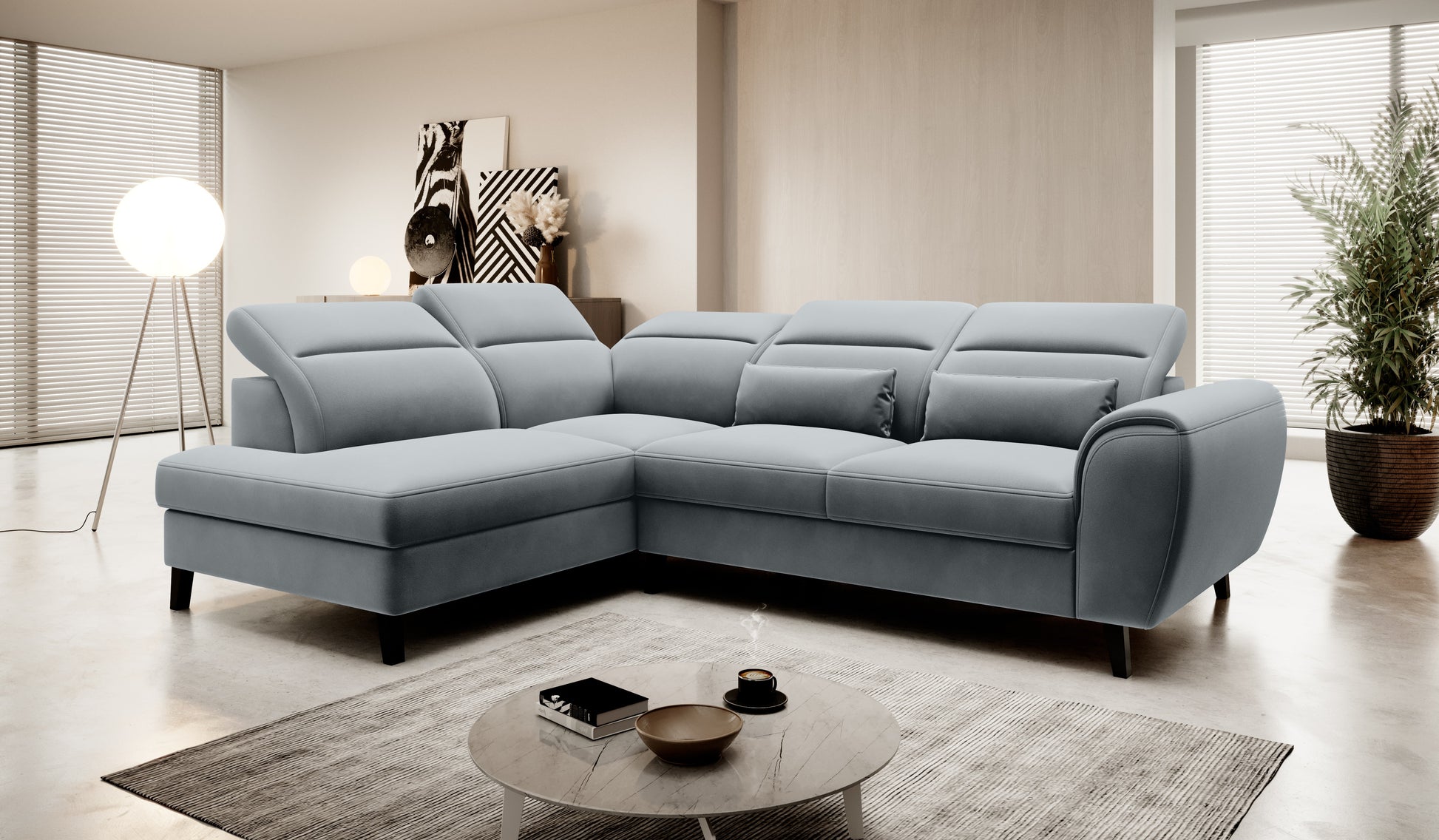 Narożnik Noble Velvetmat 04 w jasnoszarym kolorze prezentujący miękką welurową tapicerkę, szerokie siedziska oraz elegancką bryłę. Designerski narożnik do salonu zapewniający wygodę codziennego relaksu i nowoczesny wygląd wnętrza.