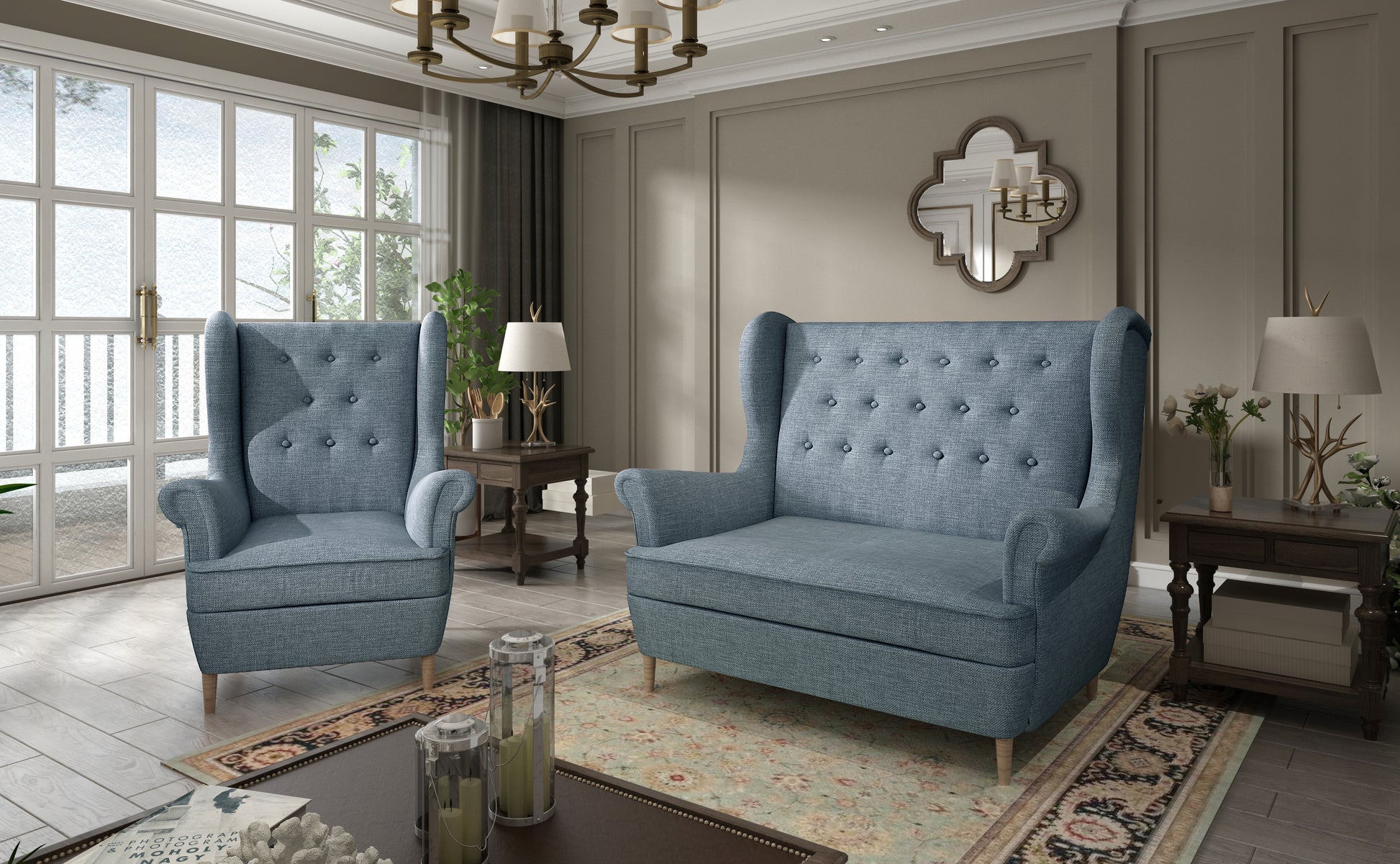 Komplet wypoczynkowy Aros w tkaninie Cover 70 niebieski – elegancki fotel i sofa w nowoczesnym salonie z jasnymi dodatkami i dużymi oknami.