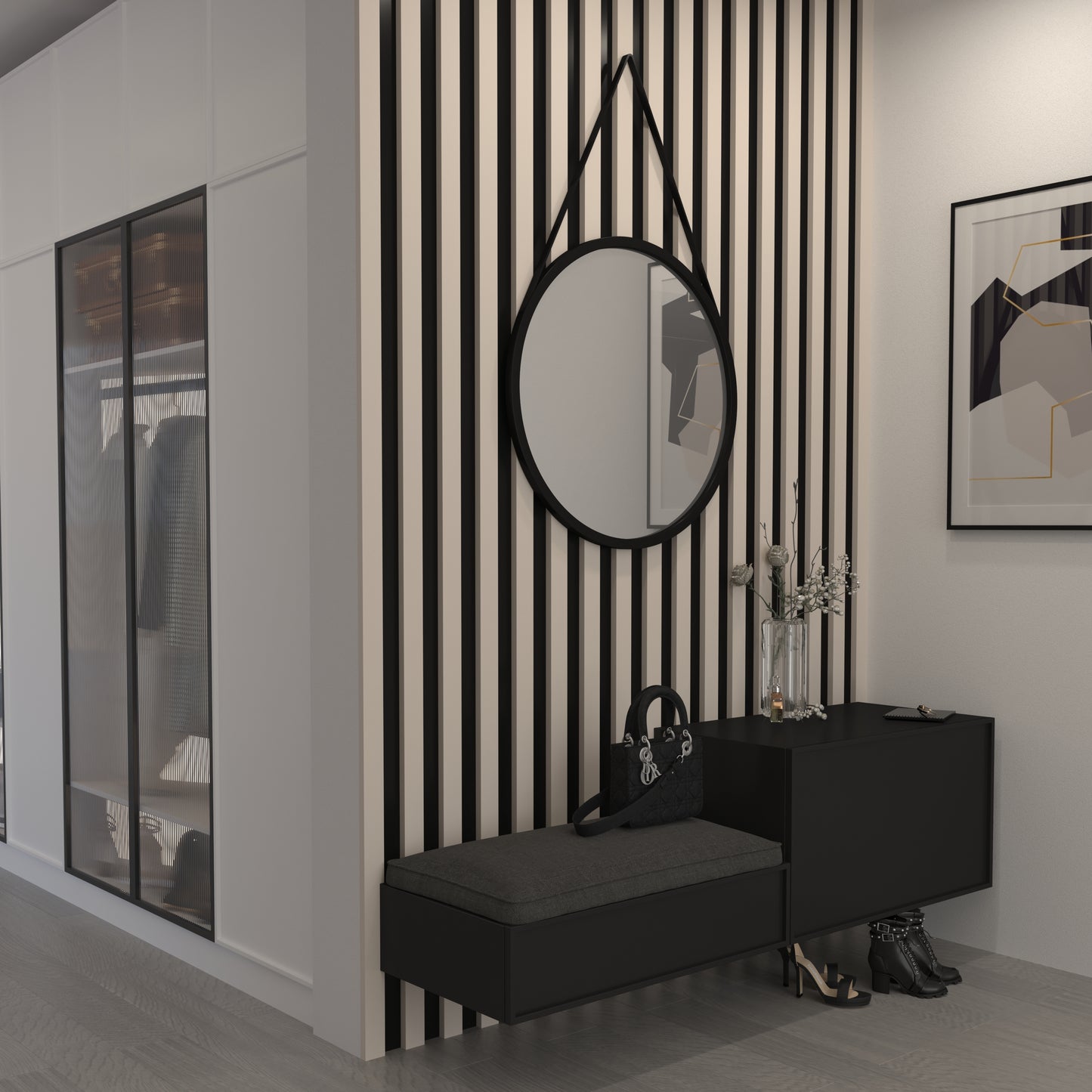Lustro Grace I o średnicy 60 cm w czarnej ramie, zawieszone na pasku w nowoczesnym przedpokoju z czarno-beżową lamelową ścianą i czarną szafką.