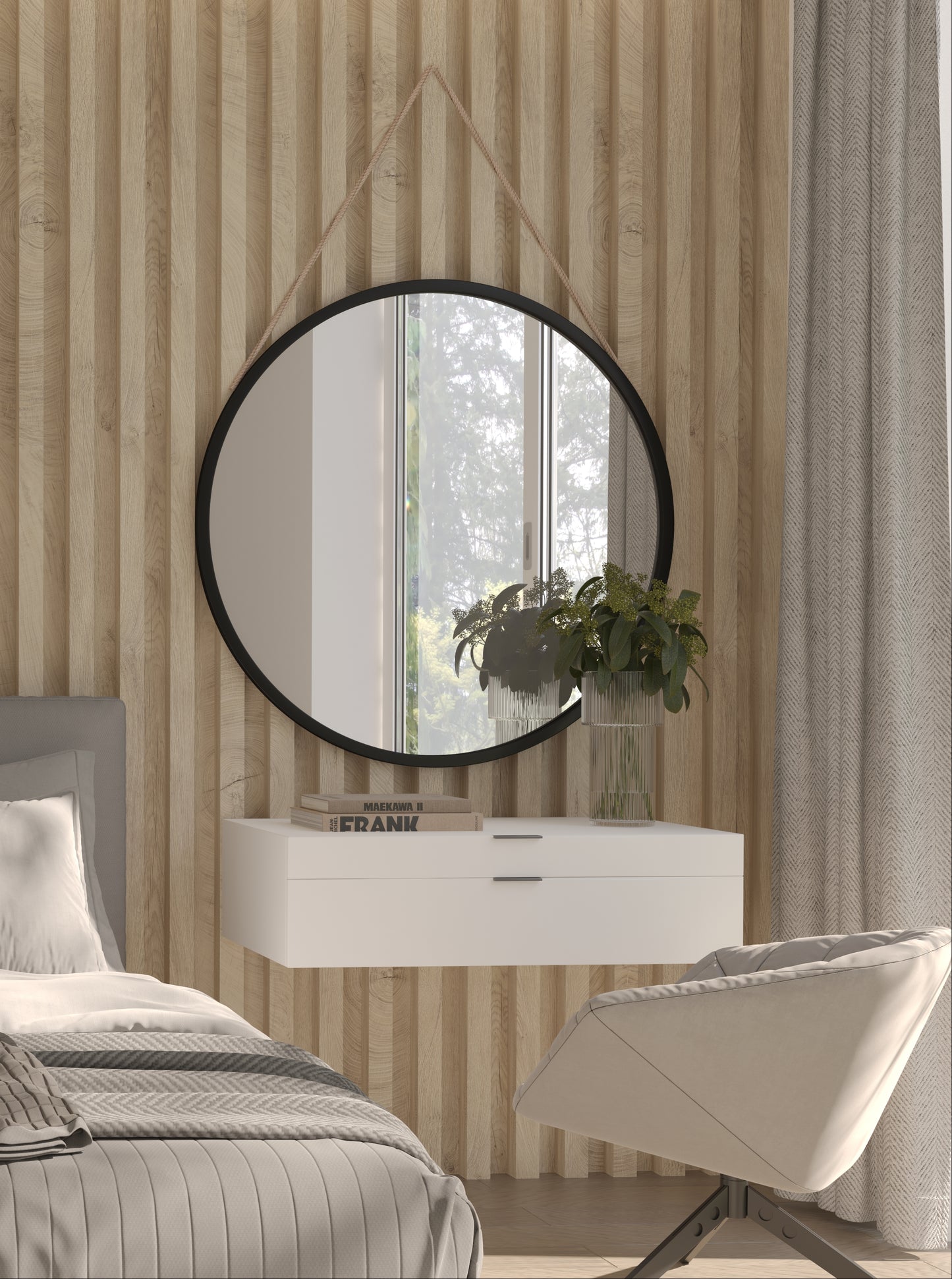 Lustro Grace II o średnicy 80 cm w czarnej ramie, zawieszone na jasnym pasku w nowoczesnej sypialni z beżową lamelową ścianą i białą szafką nocną.