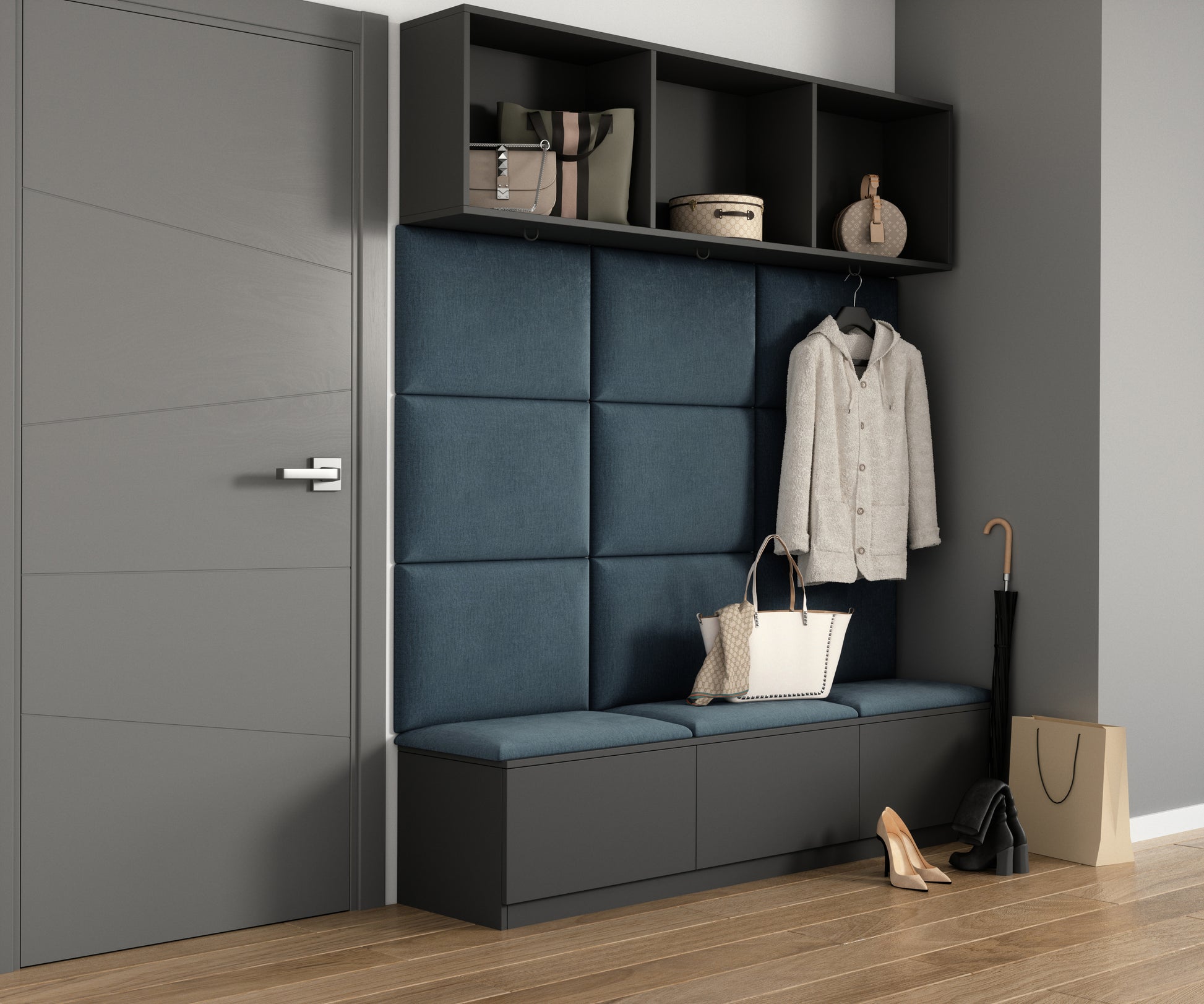 Nowoczesna wnęka przedpokoju z czarną ławką, metalowymi haczykami i półką na torby; za ławką znajduje się jasnoniebieski panel akustyczny Quadratta VI Monolith 76 z poziomymi pasami.